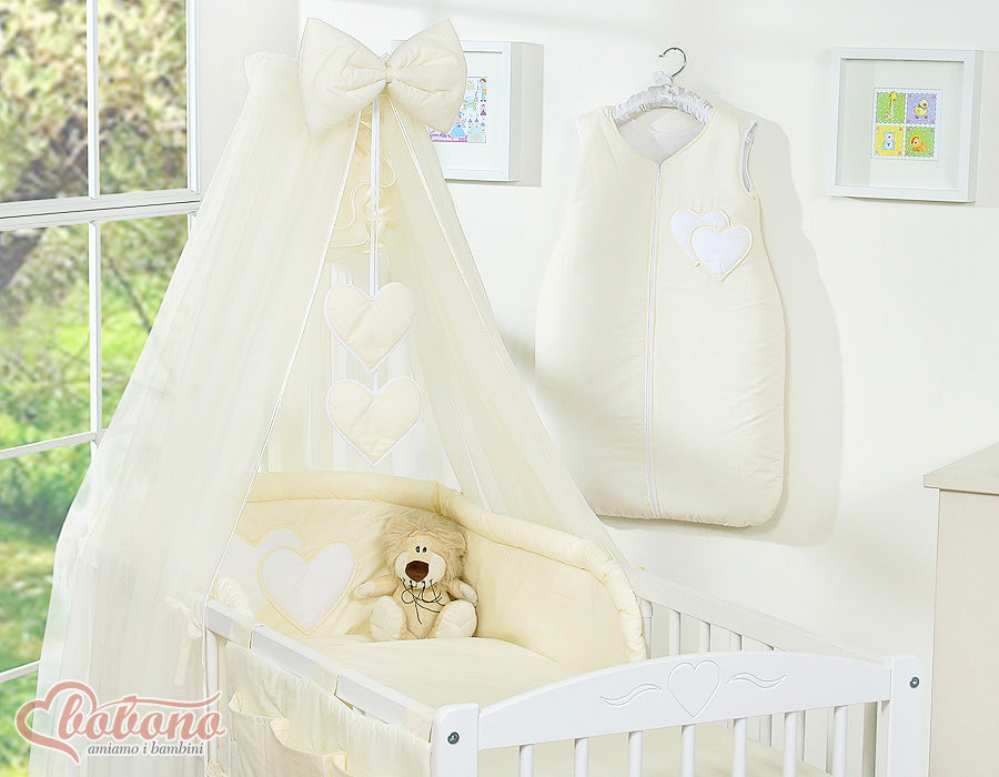 Large mosquito net for baby's bed made of chiffon with hanging hearts and a bow - cream