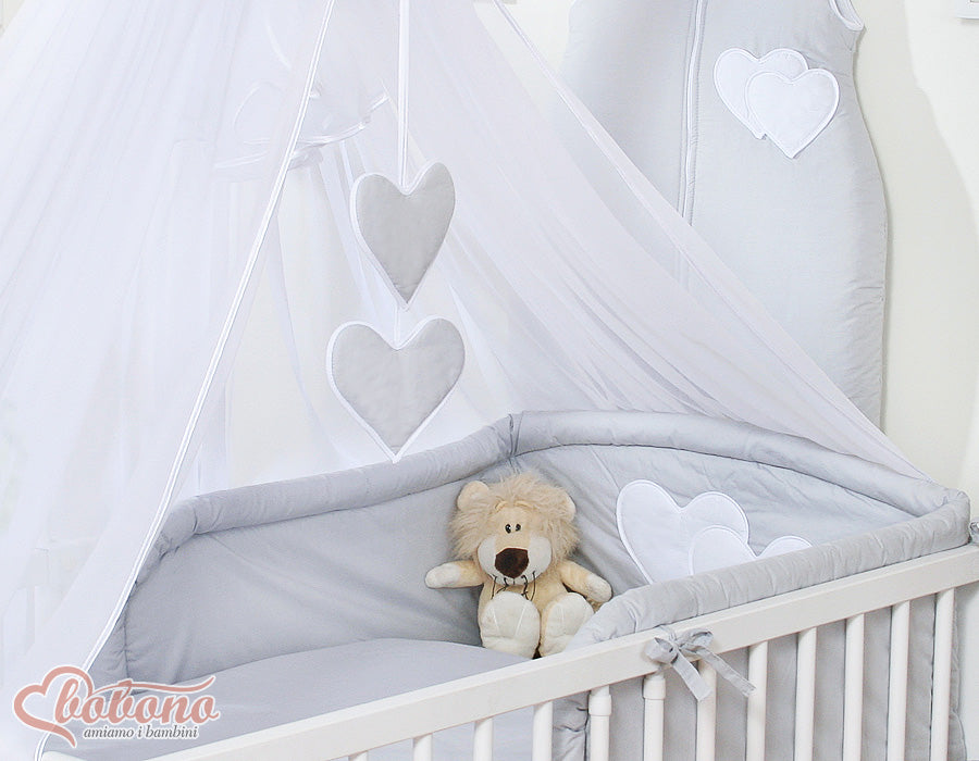 Large mosquito net for baby's bed made of white chiffon with hanging hearts and a bow - gray hangers