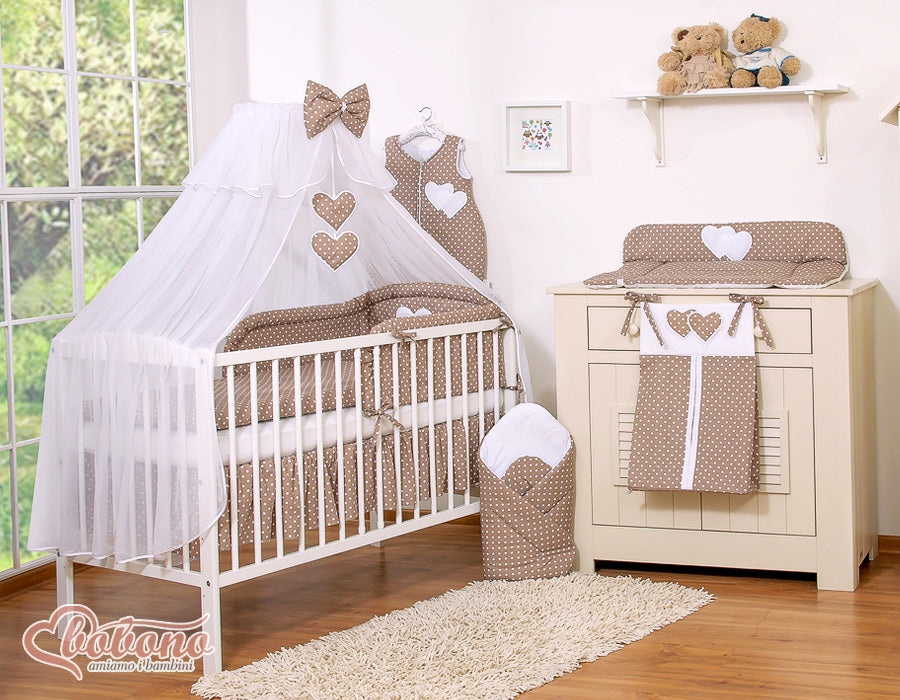Large mosquito net for baby's bed made of white chiffon with hanging hearts and a bow -dots on brown