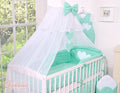 Large mosquito net for baby's bed made of white chiffon with hanging hearts and a bow - mint hangers